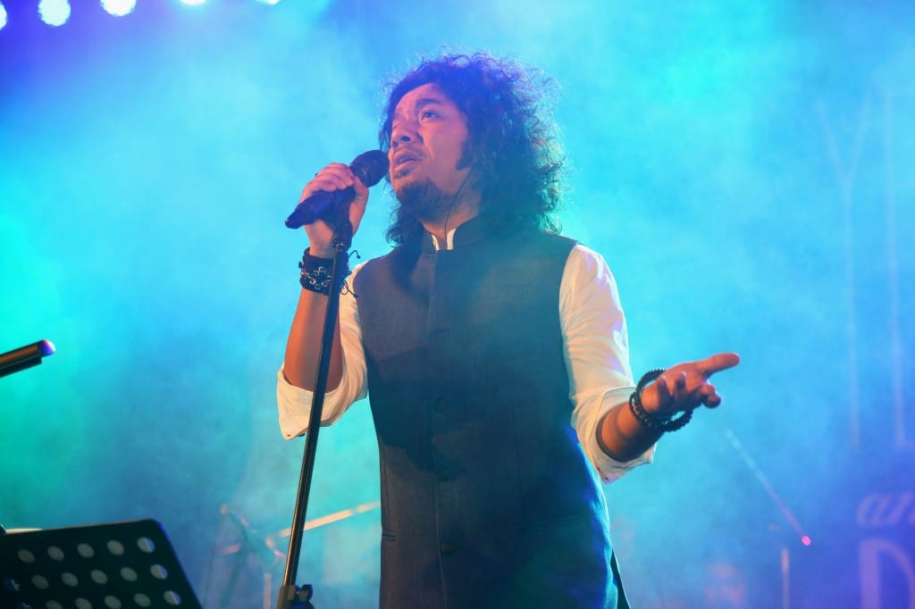 Papon performing on stage with Sennheiser