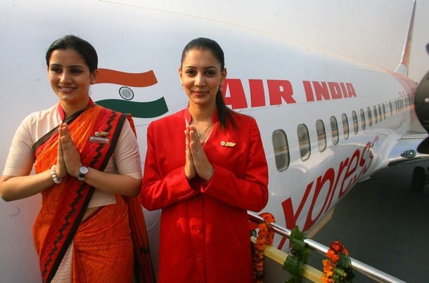 Air India air hostesses, wear their new uniform atop the Air India flight, during the delivery of the Boeing 737-800 Commercial Jetliner for Air India in New Delhi, 06 November 2006. Air India celebrated the delivery of the first of its planned order of 68 Boeing jetliners, the Boeing Next Generation 737-800 Commercial Jetliner, at the Indhira Gandhi International Airport.